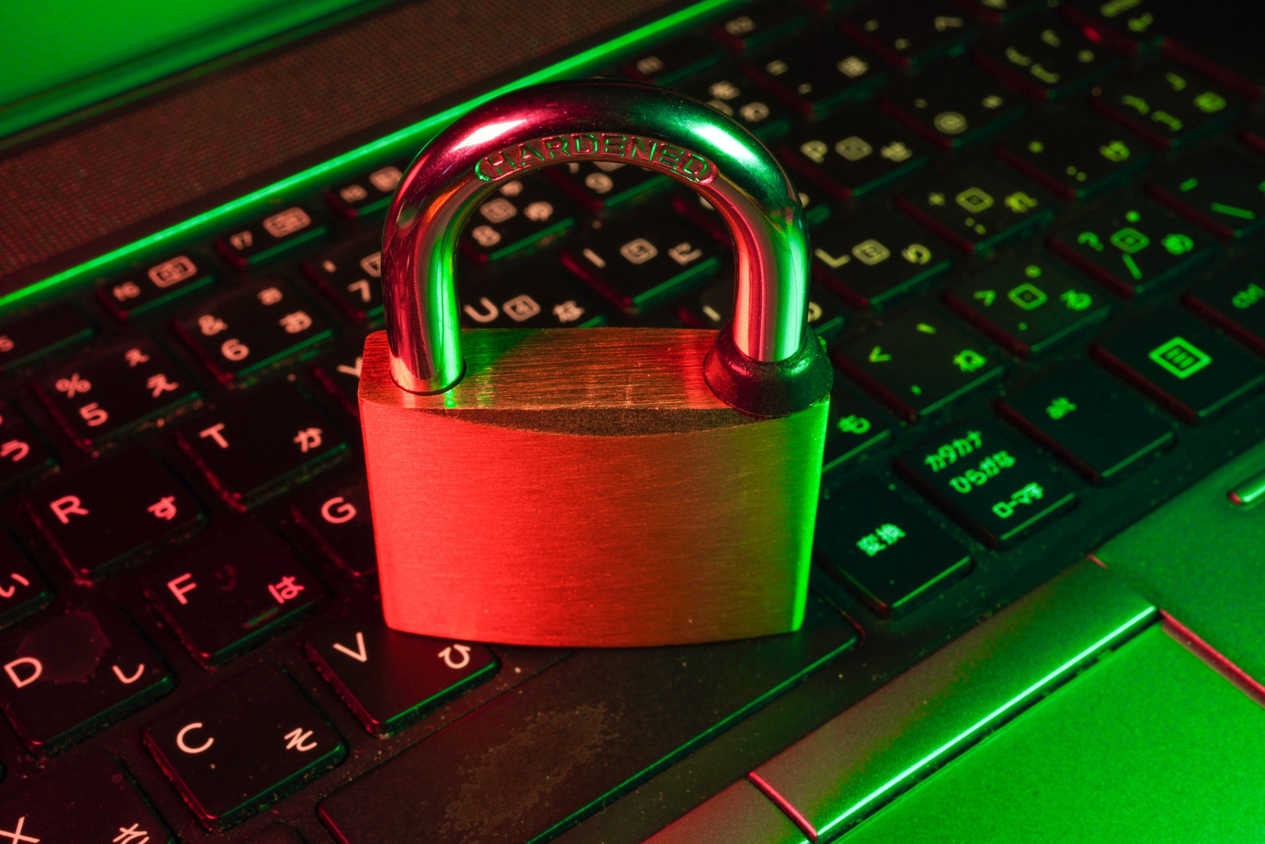 A lock is on top of a keyboard, representing cybersecurity.